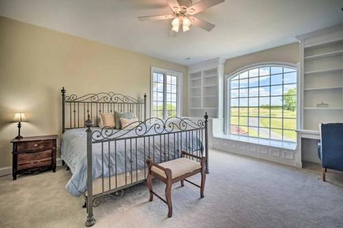 a bedroom with a bed and a ceiling fan at Manor on the 7th in Gettysburg