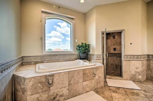 a large bathroom with a tub and a window at Manor on the 7th in Gettysburg