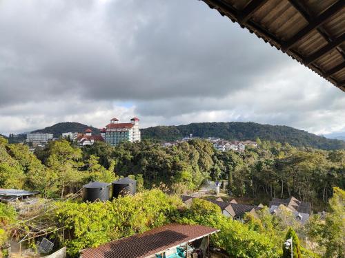 a view of a city with trees and buildings at Tekoma Resort Cameron Highlands in Tanah Rata