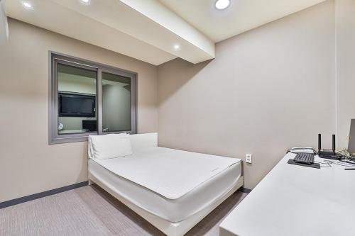 TV a/nebo společenská místnost v ubytování Top Motel Busan