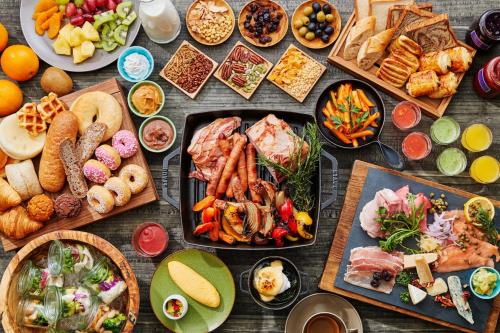 a table with many different types of food on it at Hotel Indigo Hakone Gora by IHG in Hakone