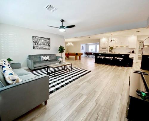 a living room with a couch and a table at South Scottsdale remodeled beauty in Scottsdale