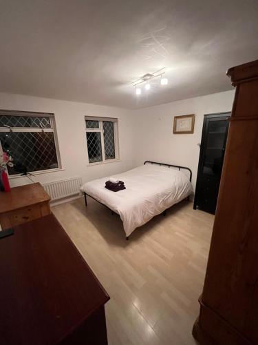 a bedroom with a bed in the middle of it at Spacious Home w/ Parking & Garden in Worthing