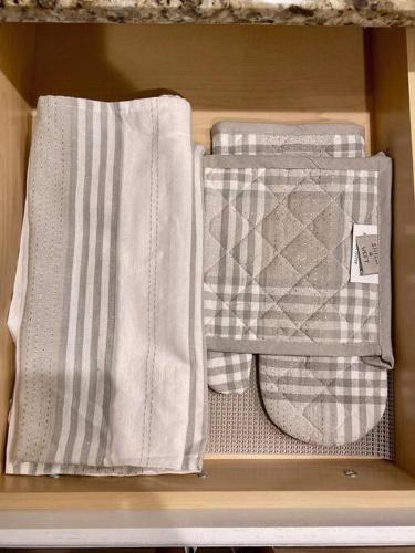 two towels sitting on a shelf in a drawer at South Scottsdale remodeled beauty in Scottsdale
