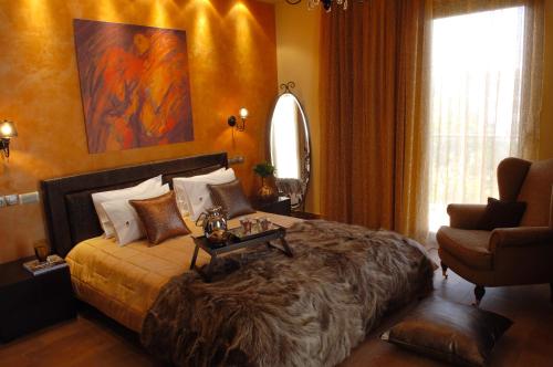 a bedroom with a large bed with a table on it at Olympic Fashion Hotels in Athens