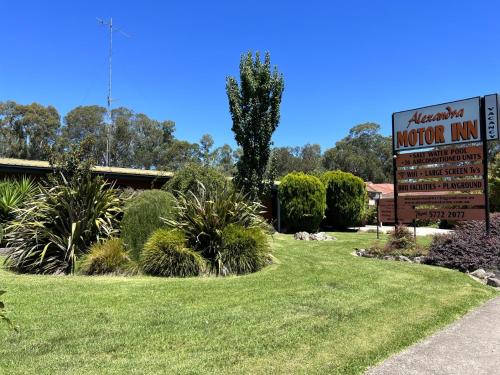 a sign for a museum in a yard with grass at Alexandra Motor Inn - Victoria Aus in Alexandra