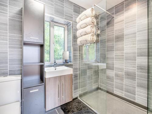 a bathroom with a sink and a mirror at Lazy Acre in Holbeach