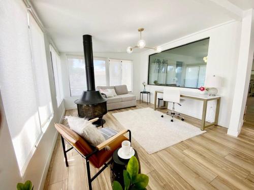 a living room with a fireplace and a couch at Newly remodeled beauty in Phoenix in Phoenix