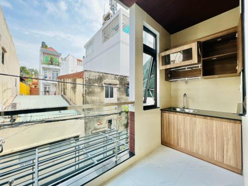 a kitchen with a large window with a view at DREAM HOUSE in Ho Chi Minh City