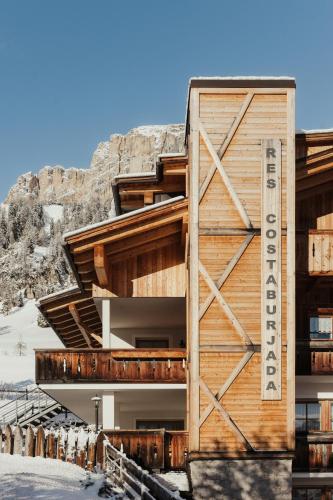 a building on the side of a mountain at Residence Costa Burjada in Colfosco