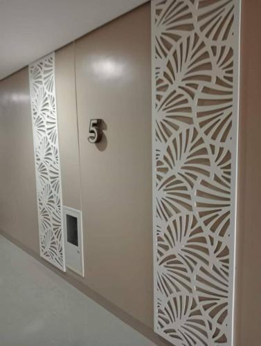 a door in a building with a wall stenciled at SMDC Cheer Residences in Marilao