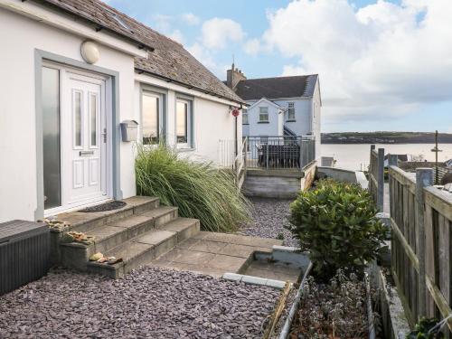 a house with stairs leading to the front door at Oakdene in Milford Haven