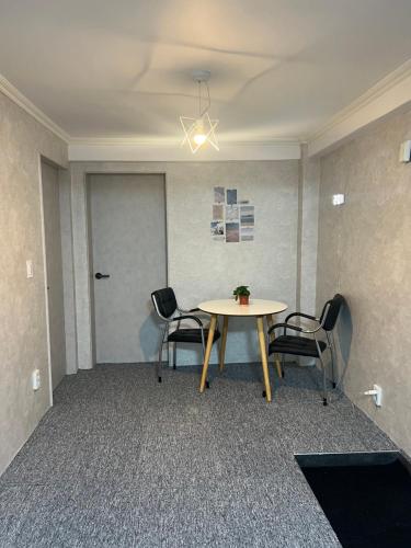 a meeting room with a table and chairs at Apartment in Gangnam in Seoul