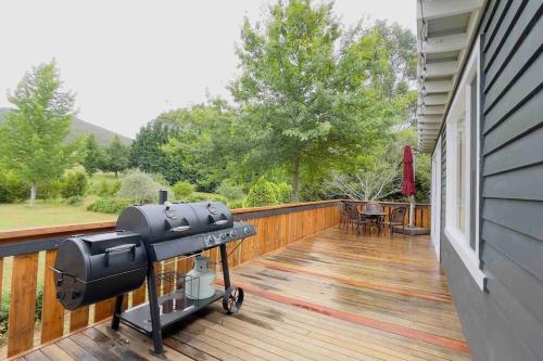 a grill on the deck of a house at Tiny house at Gilderoy Valley Views in Yarra Junction