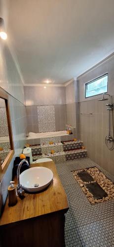 a bathroom with a sink and a shower at Ubud Harmony Private Villa and Pool in Ubud