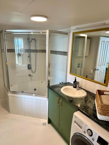 a bathroom with a sink and a shower at 8th Floor Sunny Escape at Landmark Resort in Mooloolaba