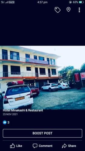 a screenshot of a hotel with cars parked in a parking lot at Minakshi hotel and restaurant in Mandi