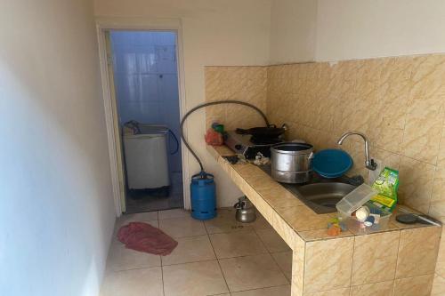 Kjøkken eller kjøkkenkrok på OYO 93623 Assalam Homestay Syariah