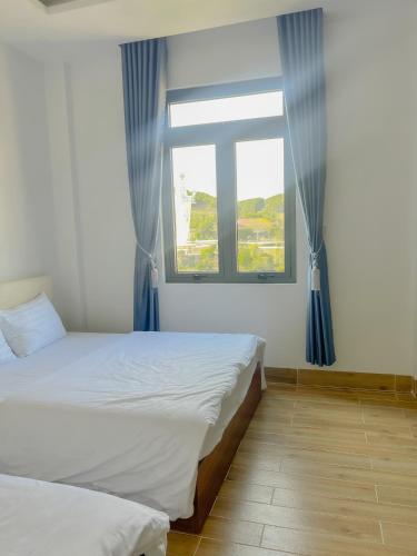Ein Bett oder Betten in einem Zimmer der Unterkunft HOTEL YÊN VIÊN