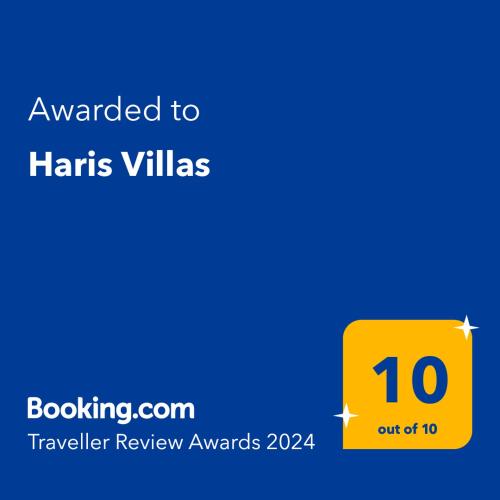 a yellow sign with the words awarded to harms villas at Haris Villas in Keratokampos