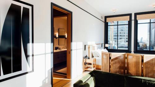 a room with a view of a bedroom with a bed at Shinola Hotel in Detroit