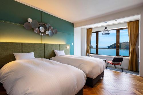 Cama o camas de una habitación en お宿行灯鳥羽