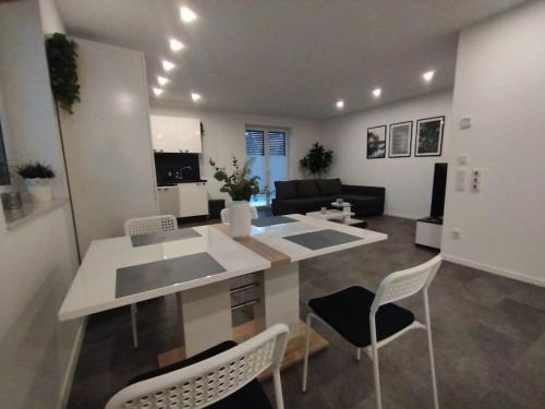 a kitchen and living room with a table and chairs at Wohnung in Werne in Werne an der Lippe
