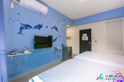 Ένα ή περισσότερα κρεβάτια σε δωμάτιο στο Baby Dolphin