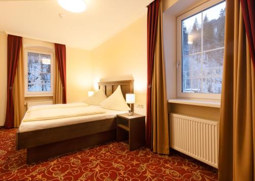 Postel nebo postele na pokoji v ubytování Appartements Feroli