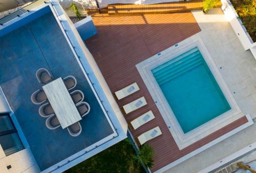 an overhead view of a swimming pool next to a building at Cascade Luxury Apartments in Dubrovnik