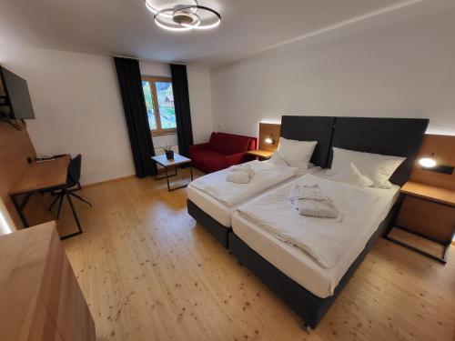 Un pat sau paturi într-o cameră la Witikohof