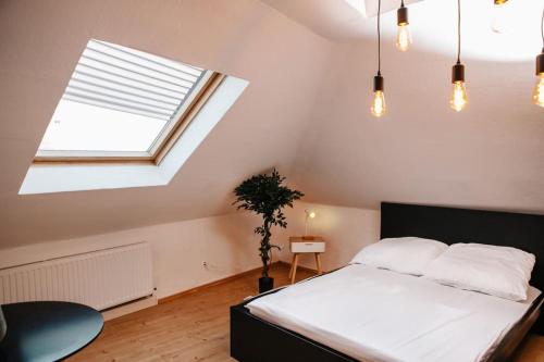 a bedroom with a white bed and a window at Modern & black - City - Netflix - Wifi - 4 Person in Bochum