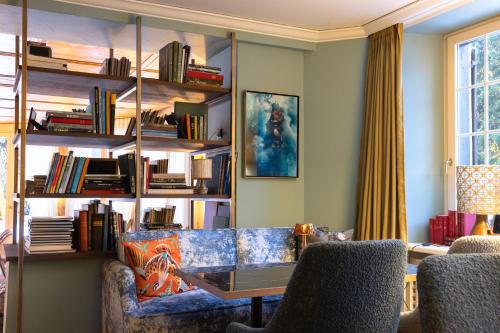 a living room with a couch and a table at Hotel Adula in Flims