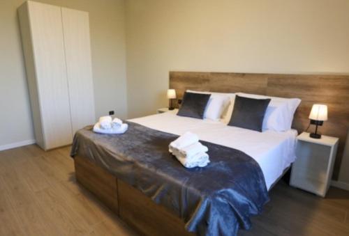 Ένα ή περισσότερα κρεβάτια σε δωμάτιο στο B&B Residenza Alba Chiara