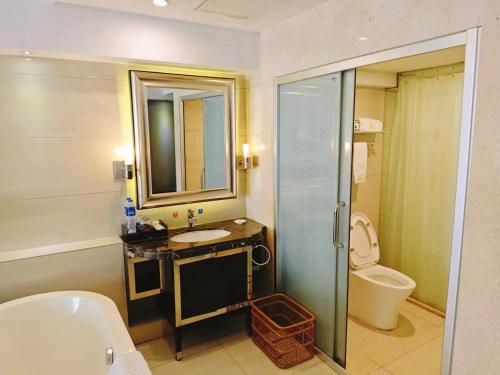 a bathroom with a sink and a toilet at 广州克莱顿酒店 Clayton Hotel Pazhou Exhibition Center in Guangzhou