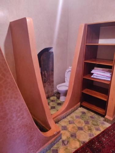 a bathroom with a staircase leading to a toilet at Riad & Restaurant Ocean Beach Douira in Agadir
