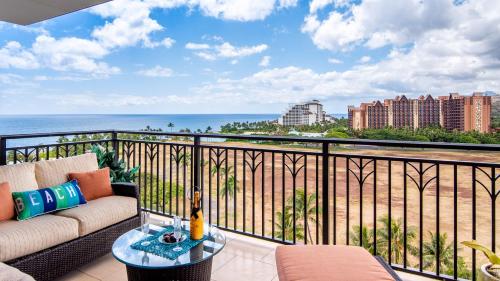 a balcony with a couch and a view of the ocean at Ko Olina Beach Villas O1111 in Kapolei
