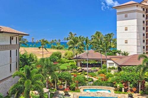 an aerial view of a resort with a pool and a building at Ko Olina Beach Villas O1121 in Kapolei