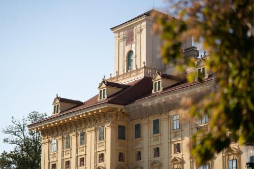 a large building with a tower on top of it at Pannonia Apartments in Mörbisch am See