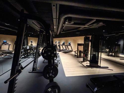 a gym with several treadmills and machines in it at Hotel Princesa Parc in Arinsal