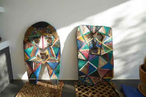 two pieces of art on display on a wall at Elegant modern Villa in olive grove in Surano