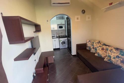 a living room with a couch and a kitchen at Porto Matrouh unique Chalet in Marsa Matruh