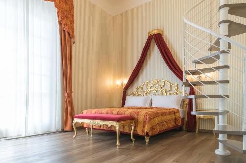 a bedroom with a bed and a spiral staircase at Regina del Garda Suite in Toscolano Maderno