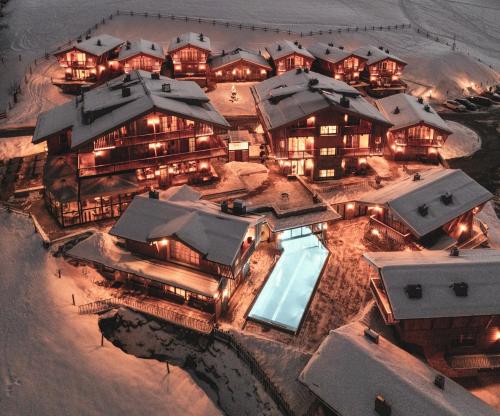 an aerial view of a resort in the snow at CHALET VILLAGE ZAGLGUT Wellness & Views with Summer Card Included in Kaprun