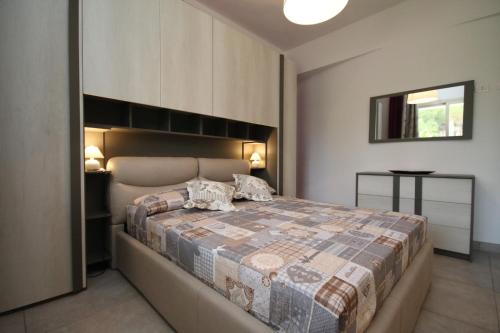 A bed or beds in a room at Villa Venera Fontane Bianche Charme Apartments