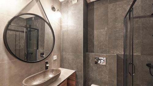 a bathroom with a sink and a mirror at Vip Casa Club Zlatibor in Zlatibor