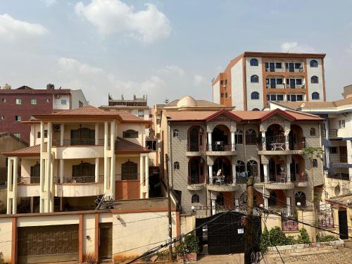 a group of apartment buildings in a city at Kc luxury in Yaoundé
