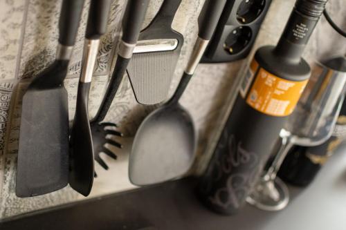 a bunch of kitchen utensils sitting on a counter at Ibiza Style Holiday chalet in Susteren