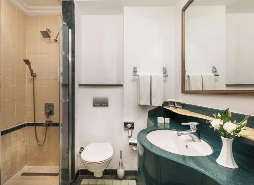 a bathroom with a sink and a toilet at Labranda Mares Marmaris Hotel in Marmaris