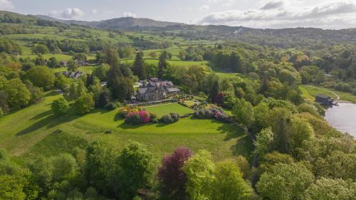 an aerial view of a house on a hill next to a river at Cragwood Country House Hotel in Windermere